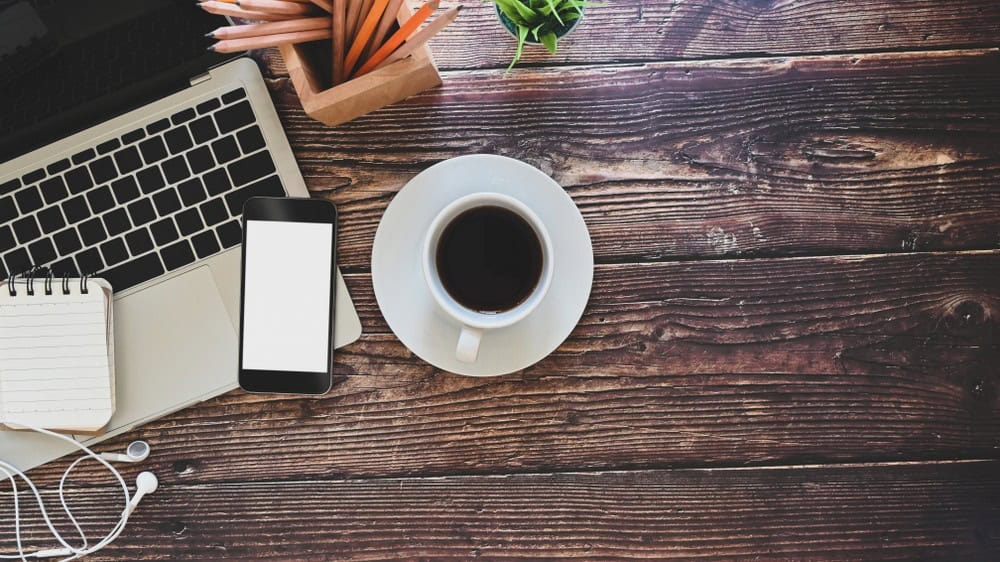 Business meeting with real estate agents and clients at a desk.