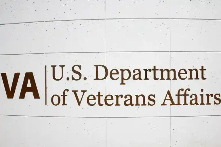 U.S. Department of Veterans Affairs sign on a wall.